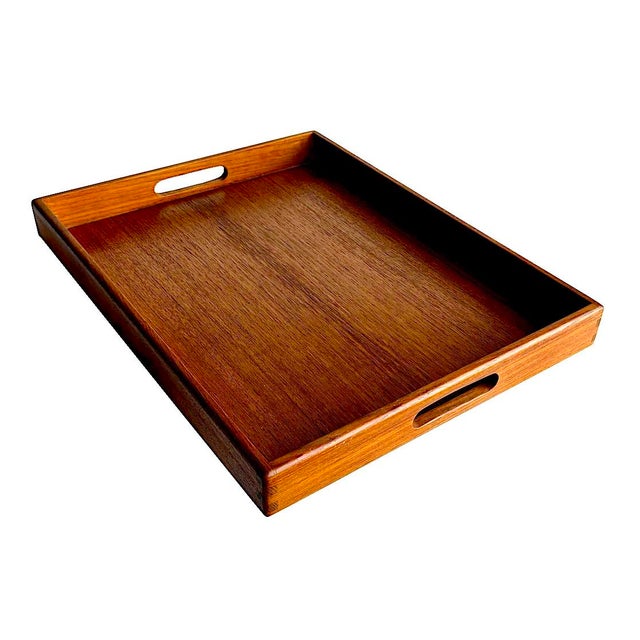 Offered is a Kalmar-brand Teak wood tray with carve out handles and dovetail joint corners made in Thailand in the 1970s....