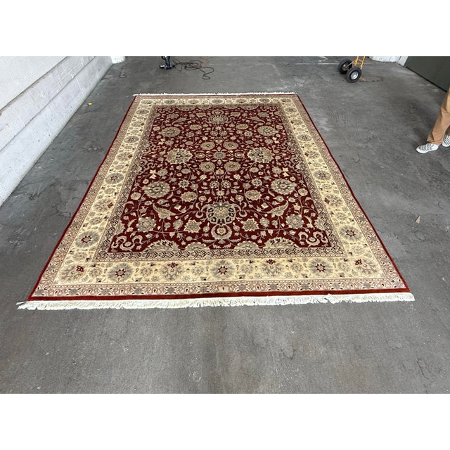 Design Plus Gallery presents a 9ft 2in X 11ft 10in Kashan Persian Rug. The deep red wool rug showcases an intricate floral...