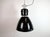 This large black industrial factory pendant light was designed and produced by elektrosvit in former czechoslovakia during...