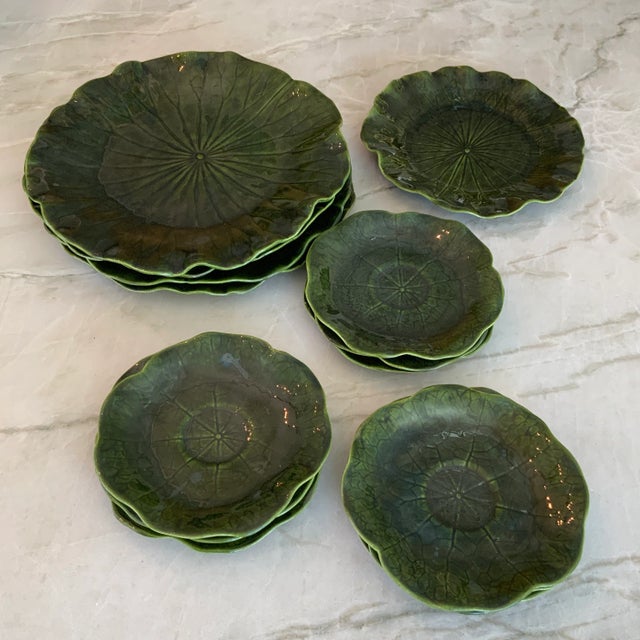 20 pieces of Metlock Potteries fabulous “Lotus” dinnerware service in dark green. Set includes one XL serving bowl 16.5”,...