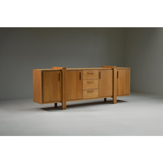 This Belgian sideboard is crafted mostly from solid oak and reflects the Brutalist style with its strong lines and...