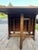This is a beautiful dining table that folds for storage against a wall. It is solid wood with gate legs. In very nice...