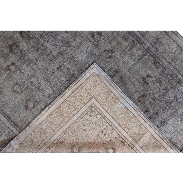 Beautiful vintage Persian distressed hand-knotted wool rug with a gray field. This piece has black and brown accents in a...