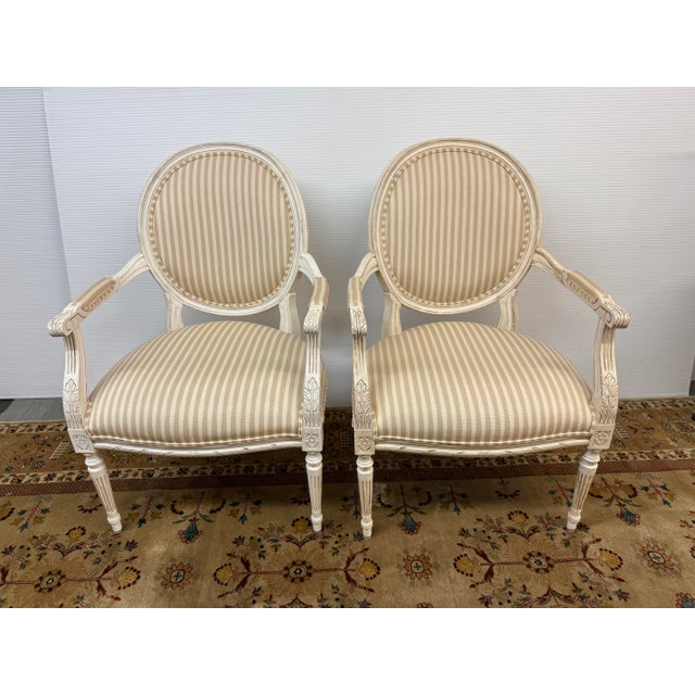 Design Plus Gallery presents a Pair of French Louis XVI Style Armchairs from Ethan Allen. Each armchair has an oval...