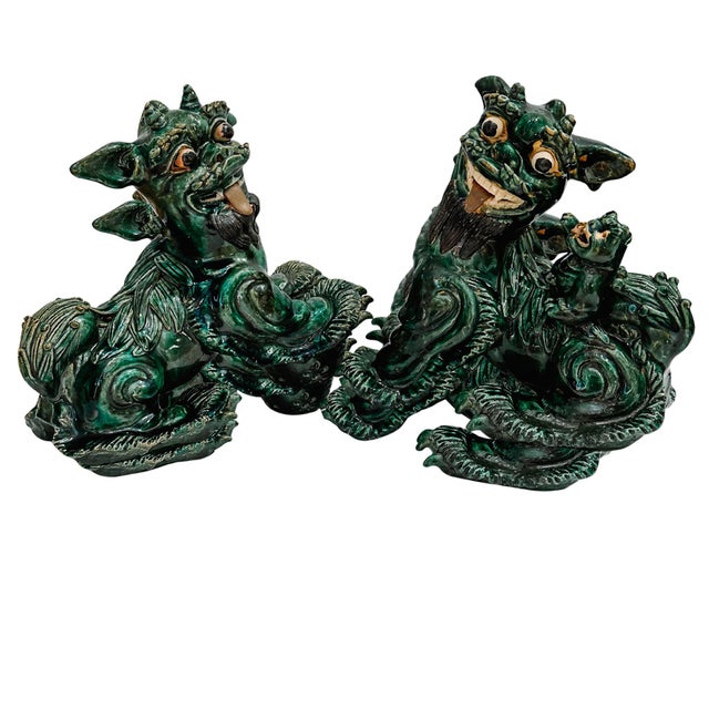 Pair of distinctive vintage Chinese green glazed pottery Kylin dragon or foo dog figurines. The Kylin, also known as Qilin...