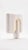 The smallest lamp in the collection, and often the first one people reach for. Its folded form hides the source entirely,...