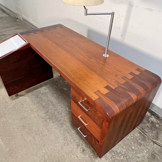 A one-of-a-kind studio craft doctor’s desk fashioned from solid planks of rosewood and teak. Built in the 1970s by a...