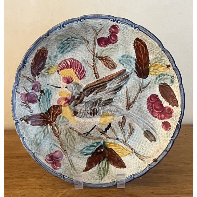 19th century majolica plate / bowl hand painted and decorated with a bird leaves and berries with a scalloped edge. Made...