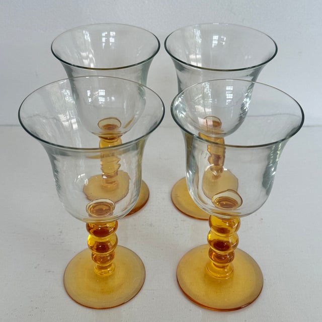 Set of 4 pretty amber stemmed wine glass water goblets. Most items found at Pub & Oasis are vintage and antique in nature...