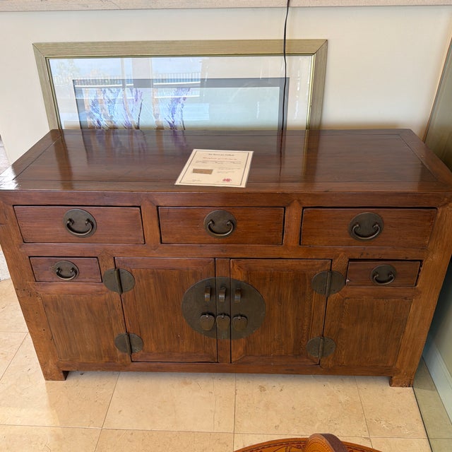 19th Century Qing Dynasty Elmwood Side Cabinet, circa 1880 A striking example of late Qing Dynasty craftsmanship, this...
