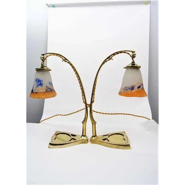 Pair of large Art Nouveau table lamps attr. to David Gueron, France circa 1915 Bronze, adjustable glass shades made of...