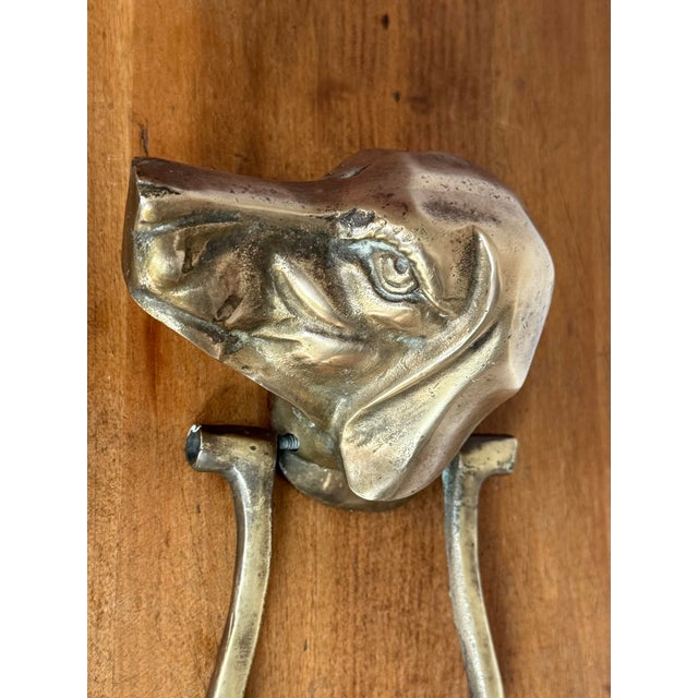 Charming midcentury detailed brass dog door knocker, a friendly welcome for your guests. Please see condition details...