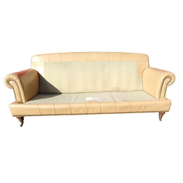 Animal Skin Sink Into the Supple, Cream-Colored Leather of the Liz Claiborne Sofa For Sale - Image 7 of 8