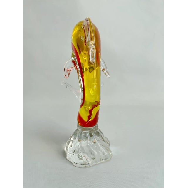 Stunning midcentury red and yellow Italian Murano dolphin fish art glass sculpture which is attractive from every angle.