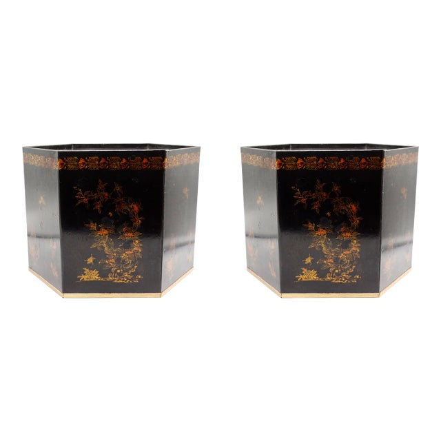 A pair of large Mid Century Italian black and gold metal toleware cachepot jardiniere in the Regency style. This lovely...