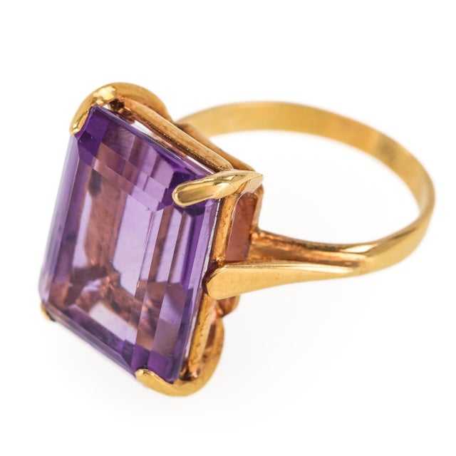 Vintage 14K Yellow Gold and Amethyst Cocktail Ring, centered by an impressive approximately ten (10) carat emerald-cut...