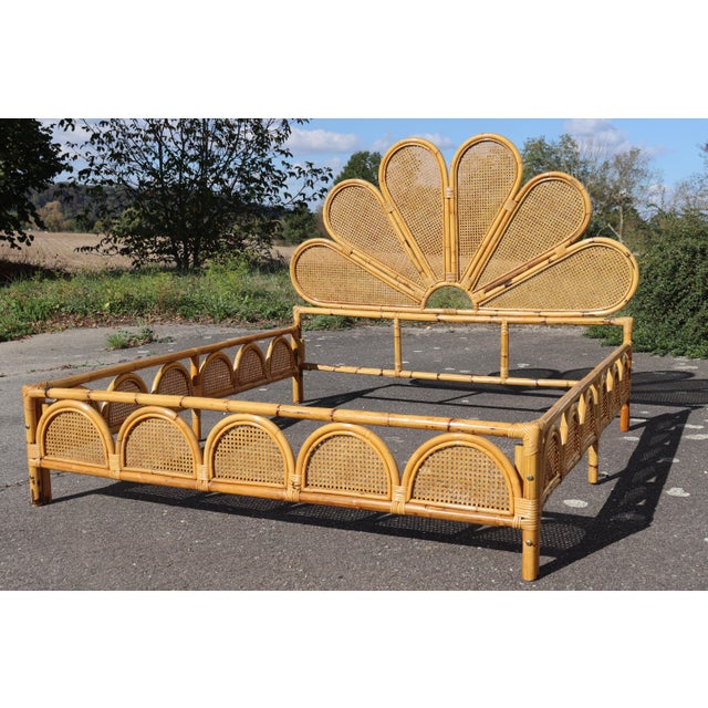 Double bed. Bamboo frame with cane detailing. Large and beautiful headboard in the shape of a flower. Dating from the...