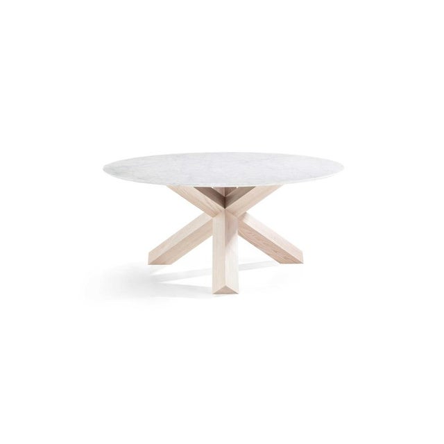 Mario bellini la rotonda table for cassina a table with timeless design by mario bellini, who morphs the natural warmth of...