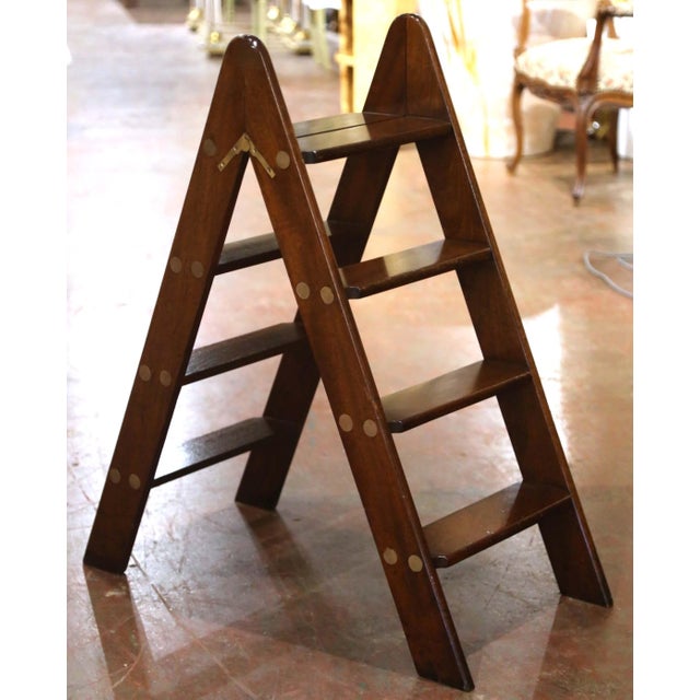 Combining practical functionality with clean geometric lines, this vintage English library ladder features a distinctive...