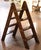 Combining practical functionality with clean geometric lines, this vintage English library ladder features a distinctive...