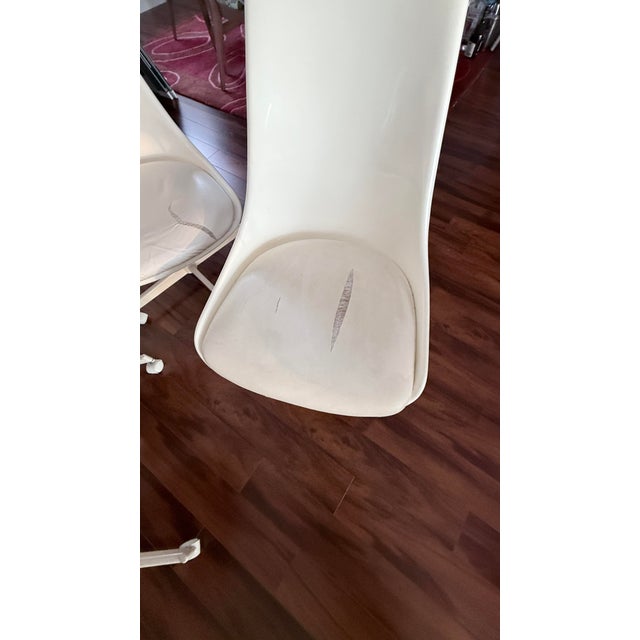 These are the REAL deal. Cushioned Chrome Craft 1975 fiberglass shell chairs on rollers. Heavy metal base. Will last a...