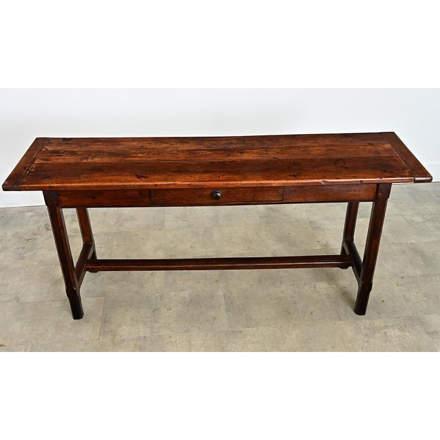 This modest console table, or server, is hand-crafted of solid walnut and oak dates to the mid-to late 19th century...