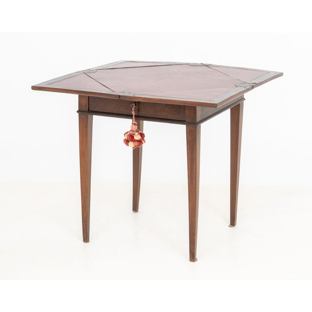 Edwardian Style Folding Envelope Game Table, the square top above a signed drawer and with marquetry inlay and four...