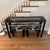 Unique vintage Post Modern black lacquer console / sofa table with glass insert. Comes with two matching nesting stools...