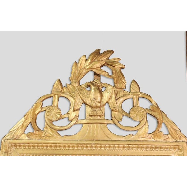Antique gilt mirror, with tassels and central eagle. Circa: 1840