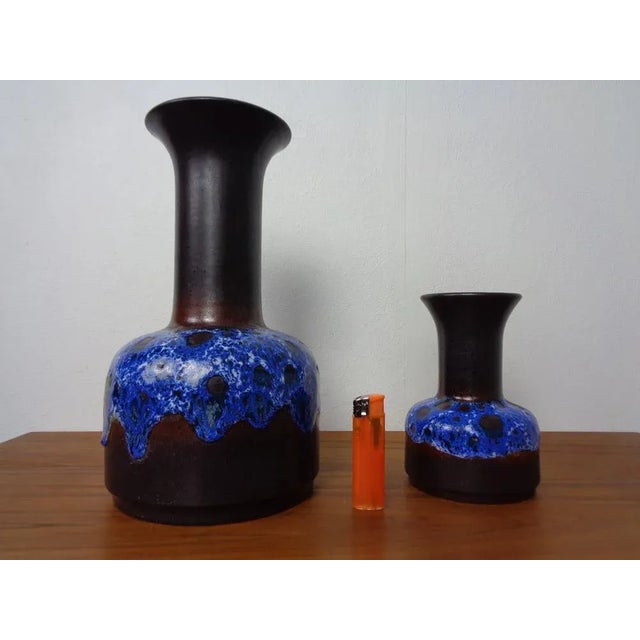 Couple ceramic vases from Jasba. Described on the underside with Jasba N 6021016 & N6021030 Height: 16 & 30 cm. This piece...