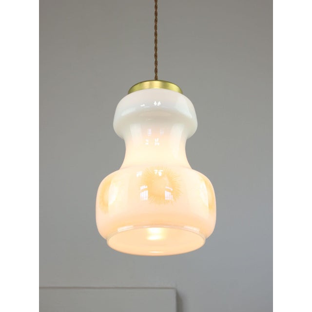 Lamp's cover is made of genuine brass material complementing this vintage item nicely with it's golden colour. total...