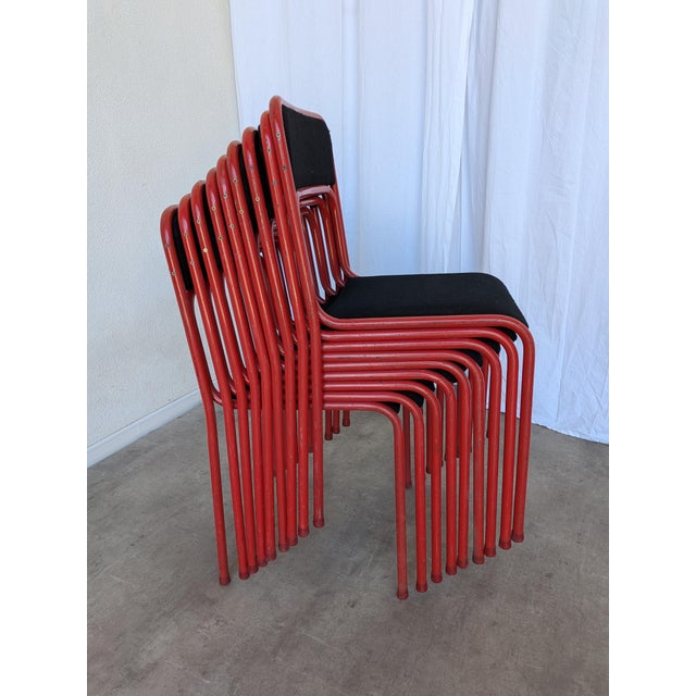 SET of 6 tubular dining chairs. The red metal base and black fabric seat give the chair a great contrast. Chairs were made...