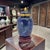A miniature lidded cloisonné ginger jar with separate stand, produced by the Beijing Enamel Factory under its Jingfa...