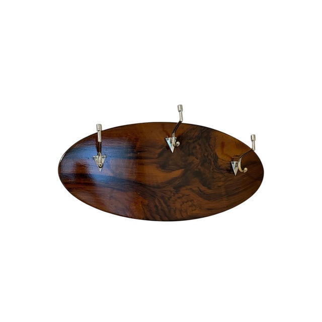 Very rare Art Deco coat hanger, Eastern Europe 1930s. Oval spruce plate in faux grained walnut (painted to imitate walnut...