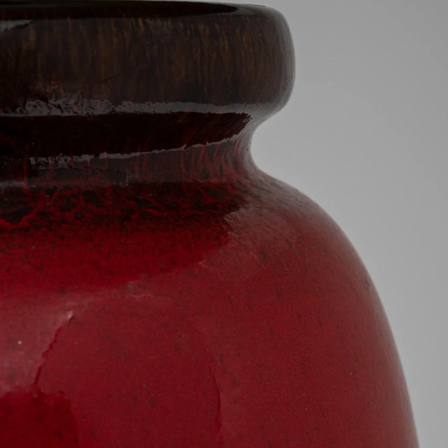 This captivating 20th-century German ceramic table lamp is a true work of art, blending vibrant colors and unique textures...