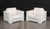 Pair of Skyline Design Lounge Chairs, with white woven plastic frames and beige cushions. 36" H x 42" W x 36" D; seat:...