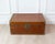 Made in France in the nineteenth century, this rectangular trunk is covered in patinated leather and decorated with rich...