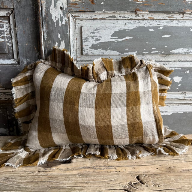 Made in France A timeless linen accent pillow with ruffle and tattered edges woven in France — The latest collection is a...