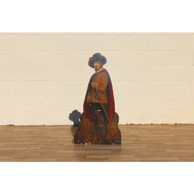 Charming antique wooden umbrella stand dating to the 1920s, featuring a hand-painted figural silhouette depicting a...