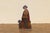 Charming antique wooden umbrella stand dating to the 1920s, featuring a hand-painted figural silhouette depicting a...