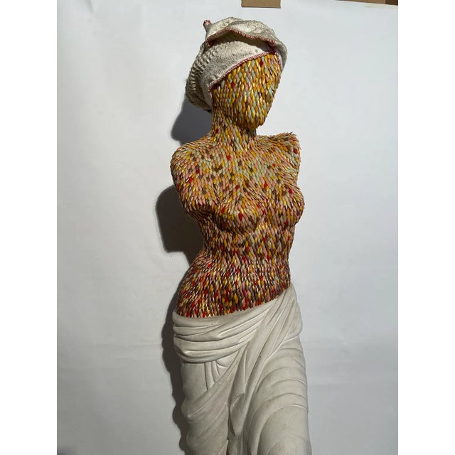 The sculpture depicts a life-size figure of a woman. it is made with an internal structure of plastic material, externally...