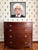 With beautifully figured mahogany, sweeping French bracket feet, and delicate string inlay, this bow front chest of...