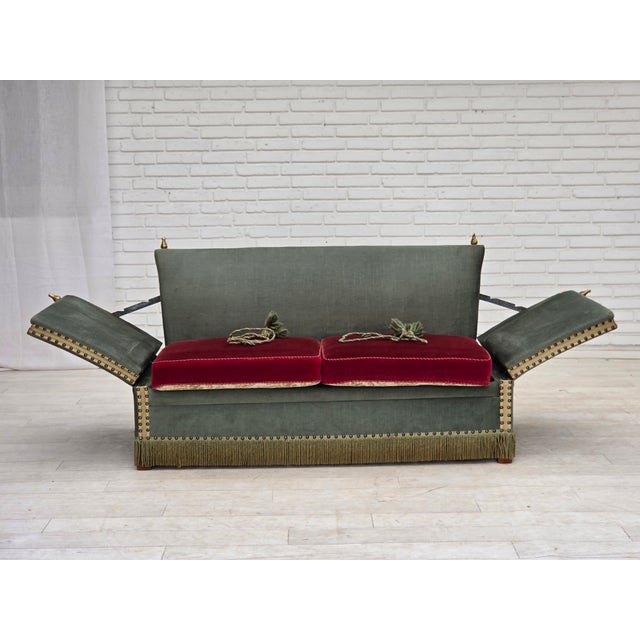 1970s, Danish 2-seater drop arm "Spanish" sofa. Original green and red furniture velour, ash wood legs, springs in the...