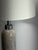 A sophisticated pair of substantial column table lamps crafted from natural cream marble with soft taupe and charcoal...