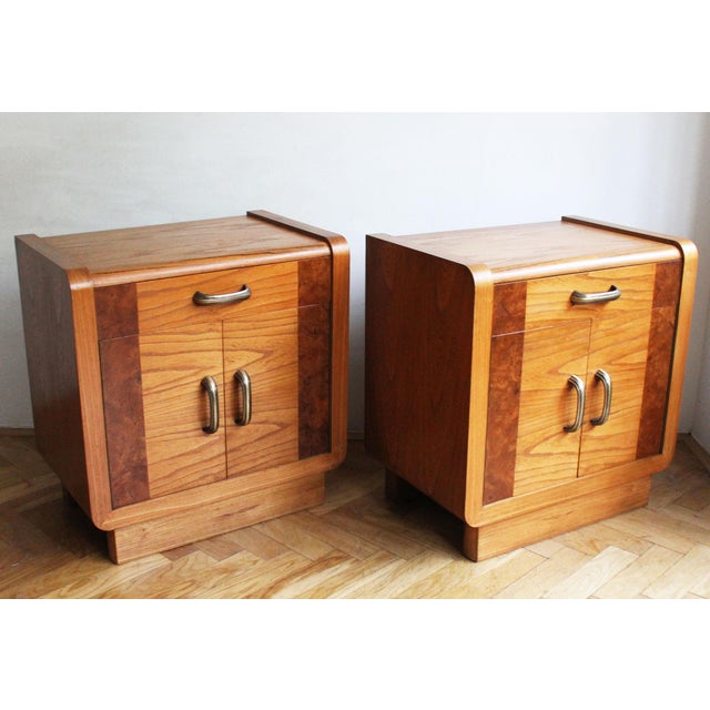 This elegant pair of Art Deco bedside tables is a beautiful example of early 20th-century craftsmanship, most likely...