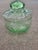 This green 1970s glass candy dish or trinket box is 5" tall with a 4 3/4" diameter. The lid makes this very functional.