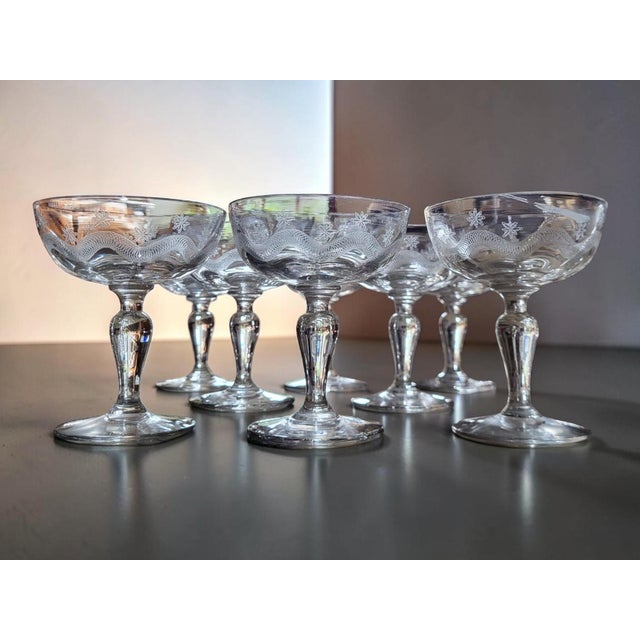 Set of 8 Meisenthal engraved glass champagne coupes, Art Deco, second quarter of the 20th century Blown glass coupes with...