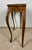 Elegant French Louis XV style console table crafted in wood with graceful curved lines and refined carved detailing. The...