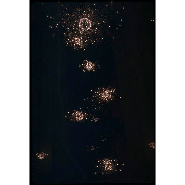 Fireworks Constellation by Toni Frissell Fireworks paint the sky at the opening of the New Metropolitan Opera, 1966....