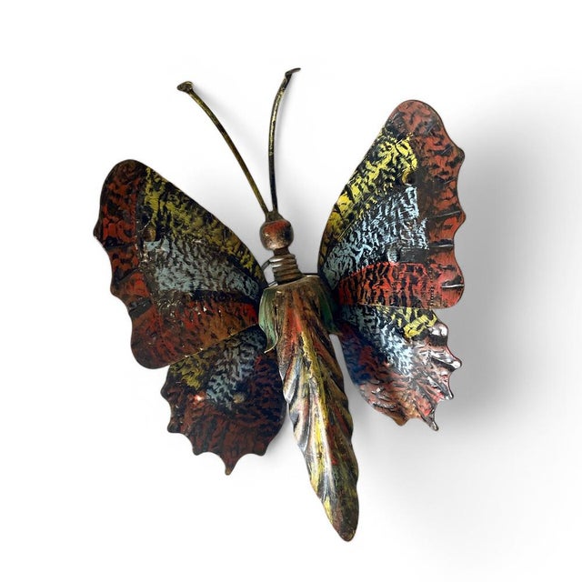 Pair of appliques in the shape of butterflies, in a modernist style. These are metal lighting pieces, with a great sense...